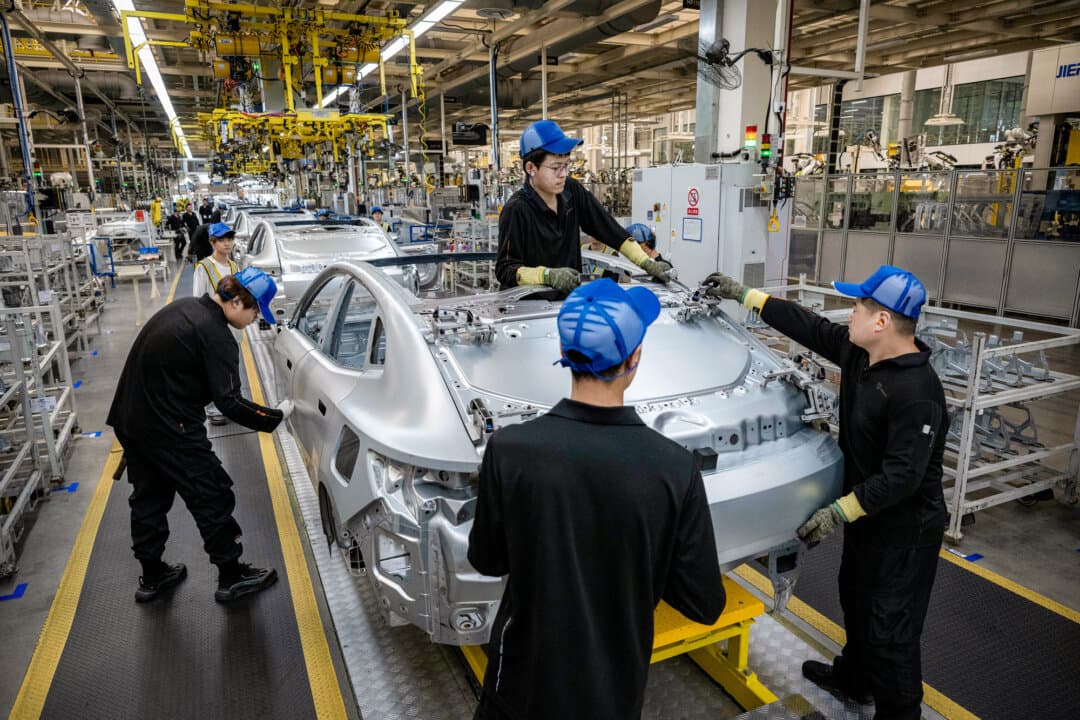 Workers assemble a car frame on the production line for electric vehicle maker Zeekr at its factory in Ningbo, China, on May 29, 2025. Canada is allowing a rising number of Chinese-made electric vehicles in at a tariff of 6.1 percent, down from 100 percent. (Kevin Frayer/Getty Images)