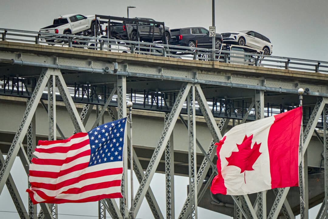 A truck with vehicles crosses the Blue Water Bridge border crossing into the United States from Sarnia, Canada, on April 3, 2025. Washington has signaled that it will turn back Chinese-made vehicles trying to enter from Canada. (Geoff Robins/AFP via Getty Images)