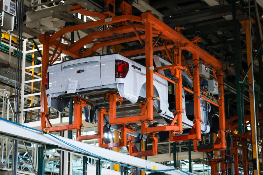 The body of a Ford F-150 truck moves along the assembly line before the arrival of President Donald Trump at the Ford River Rouge complex in Dearborn, Mich., on Jan. 13, 2026. Chinese cars threaten American factory jobs even if no Chinese cars are sold south of the Canadian border, industry experts say. (Anna Moneymaker/Getty Images)