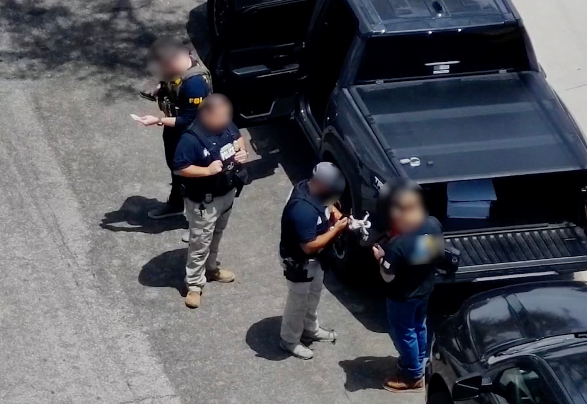 FBI agents examine an illegally operated drone during the FIFA World Cup tournament. (FBI)