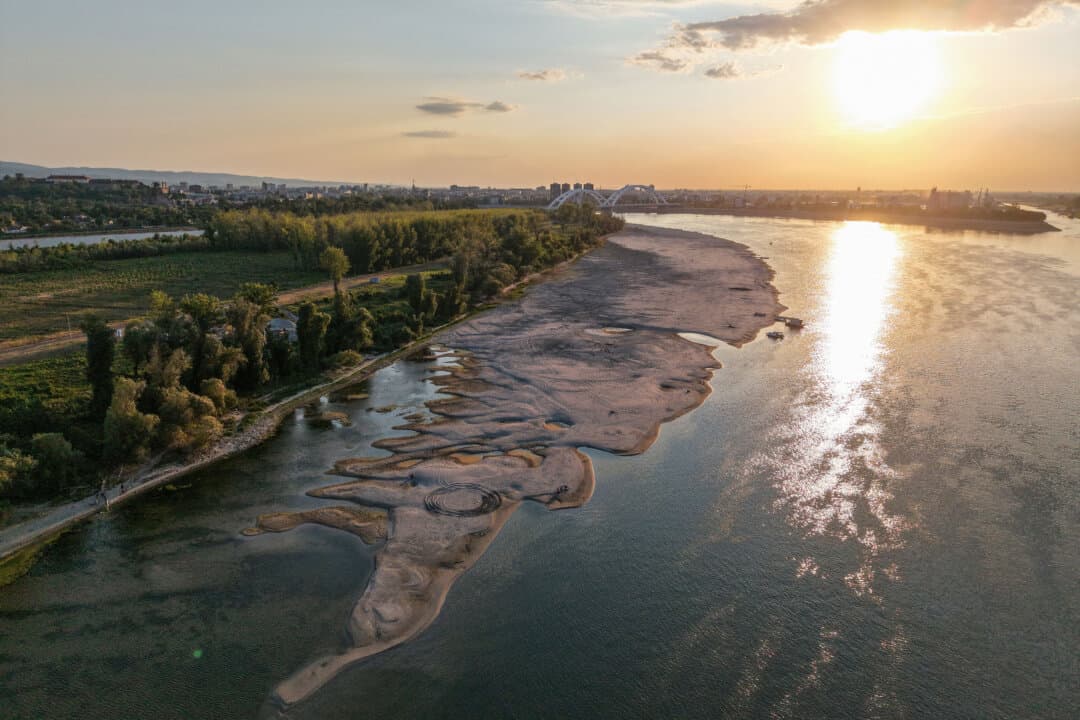 Sandbars appear in the shallow waters of the Danube River near Novi Sad, Serbia, on July 27, 2026. Prolonged drought and hot weather across Europe have pushed water levels along the Danube to record seasonal lows, with the river reaching its lowest flow rate in 30 years. (Nenad Mihajlovic/AFP via Getty Images)