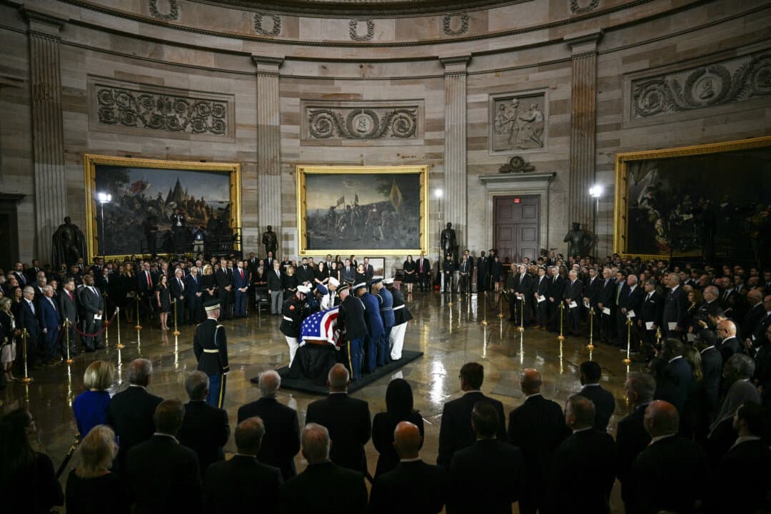 A military honor guard carries the casket of the late U.S. Sen. Lindsey Graham into the Rotunda during a congressional tribute at the U.S. Capitol in Washington, on July 28, 2026. Graham, a South Carolina Republican, died at age 71 on July 11. (Brendan Smialowski/AFP via Getty Images)