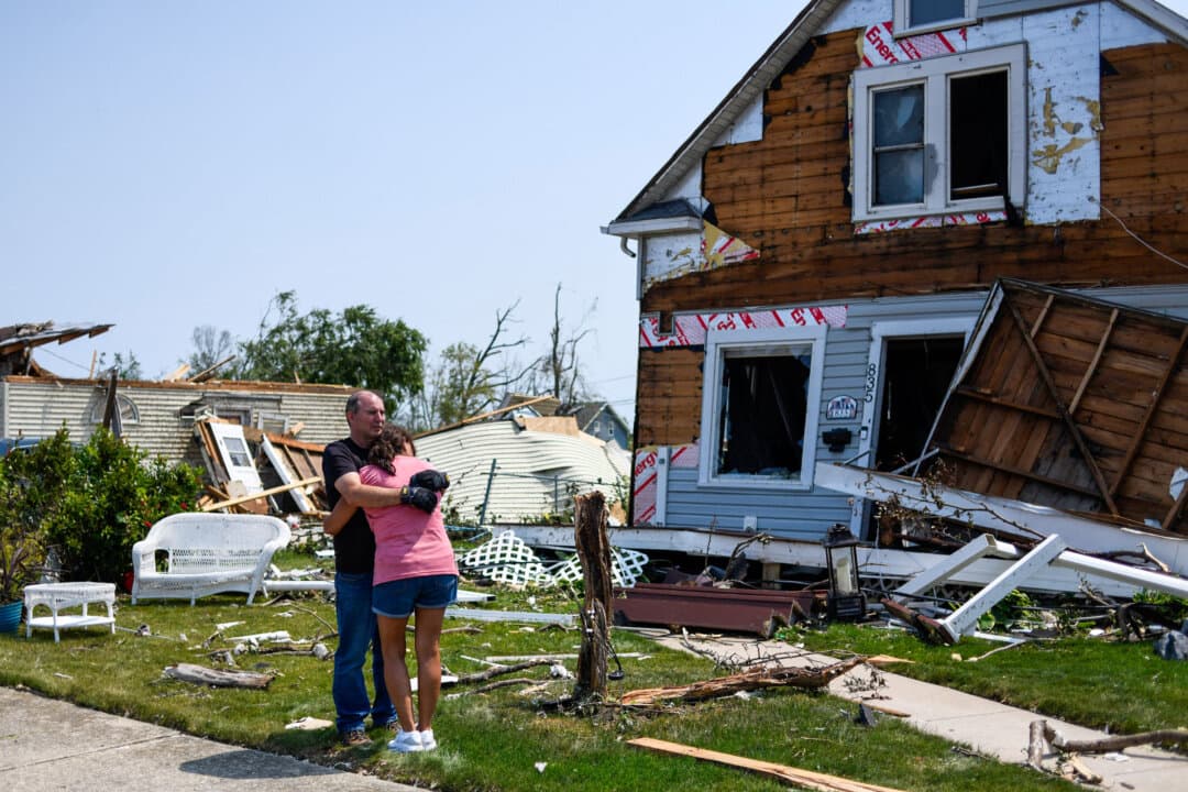 Residents assess the damage to their property a day after a tornado ripped through Menasha, Wis., on July 28, 2026. (Octavio Jones/AFP via Getty Images)
