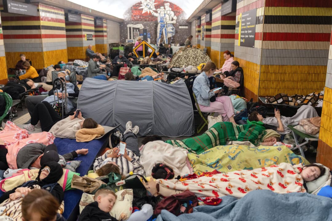 People take shelter at a metro station during a Russian missile strike on Kyiv, Ukraine, early on July 30, 2026. Russian strikes on Kyiv killed at least one person, according to authorities. (Oleksii Filippov/AFP via Getty Images)