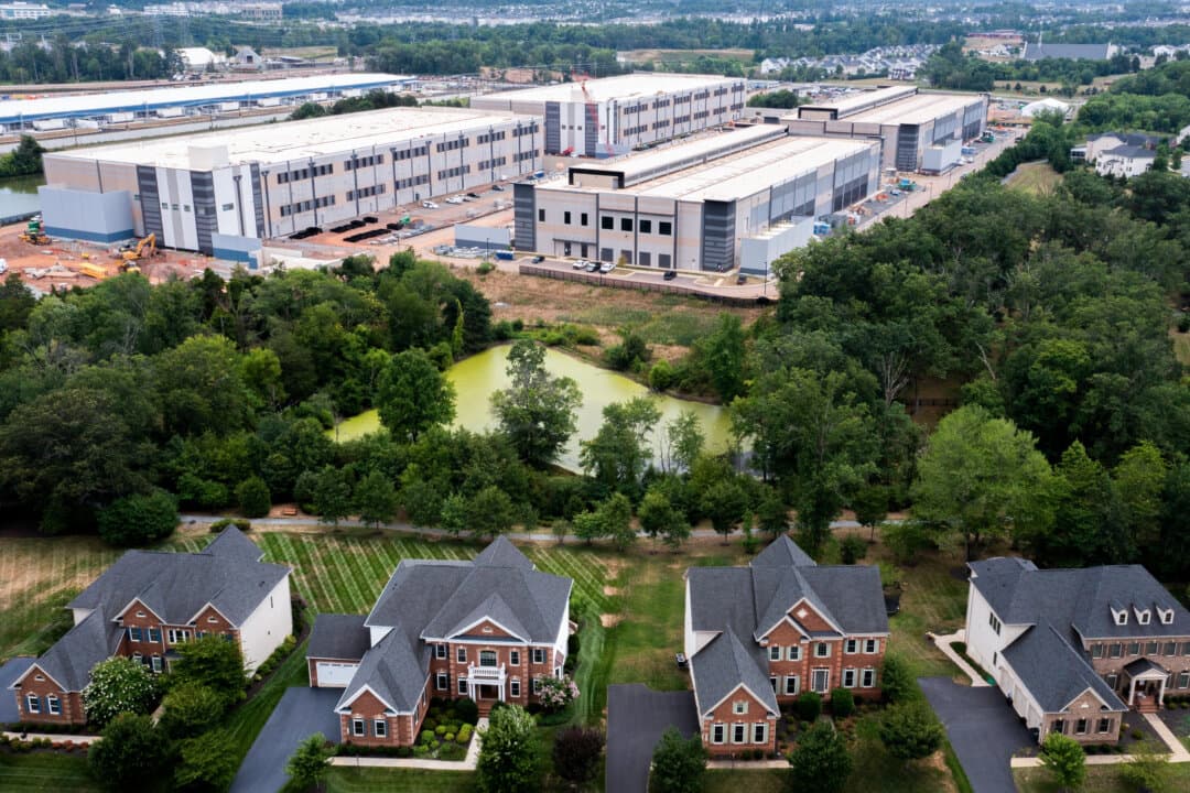 An aerial view highlights the proximity of an Amazon Web Services data center to single-family homes in Stone Ridge, Va., on July 17, 2024. As opposition against data centers grows in the United States, analysts said the potential risk of Beijing meddling behind the scenes is serious. (Nathan Howard/Getty Images)