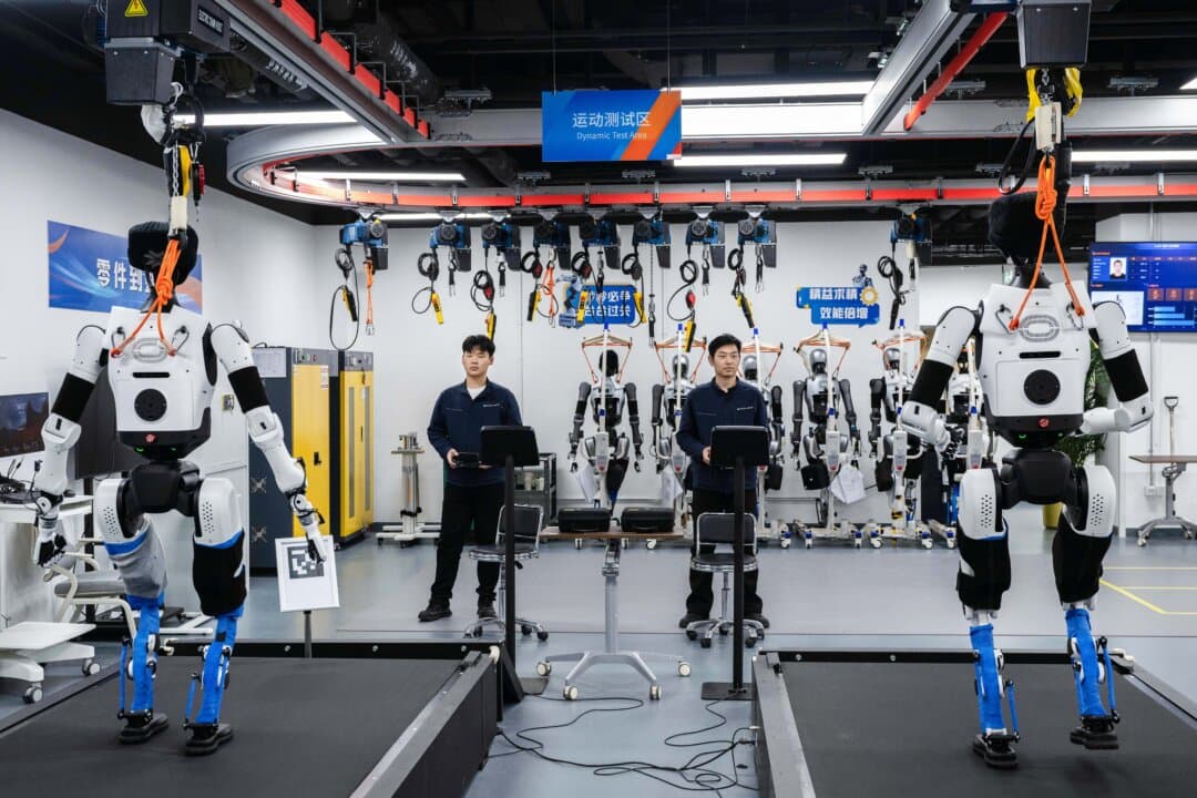 Engineers carry out testing on humanoid robots in the production facility of X-Humanoid at the Beijing Innovation Center of Humanoid Robotics in Beijing on March 20, 2026. (Kevin Frayer/Getty Images)
