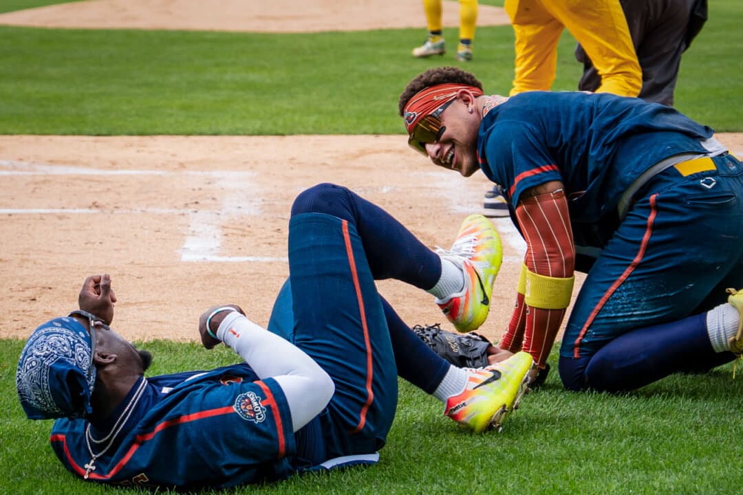 (Top Left) A chicken fight spills onto the field at a Savannah Bananas versus Indianapolis Clowns game in Denver on Aug. 15, 2026. (Top Center) Banana Ball fans stand for the national anthem as the game begins in Denver on Aug. 15, 2026. (Top Right) Dakota “Stilts” Albritton is on the mound during the Savannah Bananas versus Indianapolis Clowns game in Denver on Aug. 15, 2026. (Bottom Left) The Man-Nanas entertain Banana Ball fans in Denver on Aug. 15, 2026. (Bottom Center) Goofy antics at Coors Field in Denver on Aug. 15, 2026. (Bottom Right) Split, the official mascot of the Savannah Bananas, interacts with fans in Denver on Aug. 15, 2026. (Madalina Kilroy/The Epoch Times)