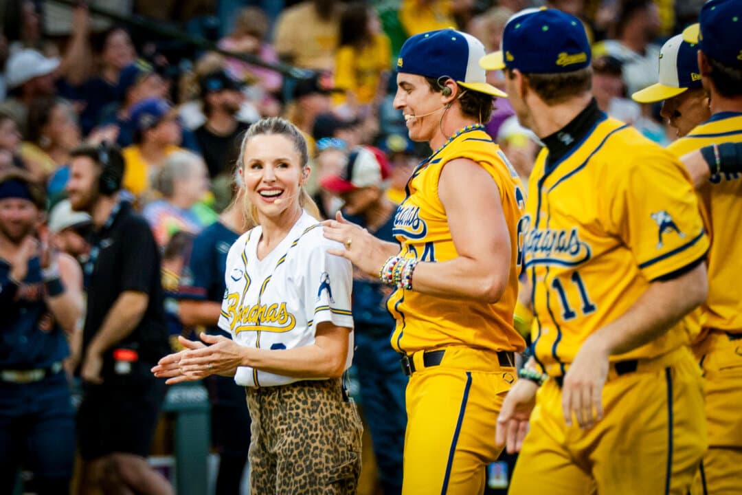 (Top) Actress and singer Kristen Bell does the angel lift after singing "Time of My Life" with Savannah Bananas relief pitcher and Broadway star Derek Klena (L), in Denver on Aug. 15, 2026. (Bottom Left) Actress and singer Kristen Bell (L) with Broadway star Derek Klena. (Bottom Right) Actress and singer Kristen Bell (R) performs a duet with Broadway star and Savannah Bananas relief pitcher Derek Klena. (Madalina Kilroy/The Epoch Times)