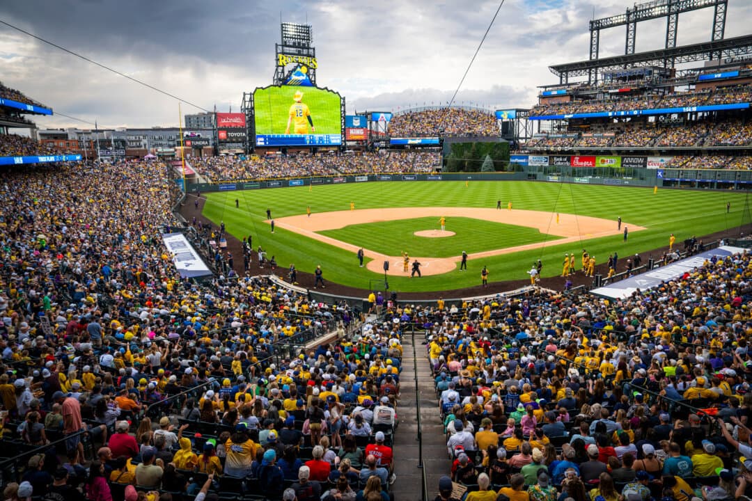 Fans fill Coors Field stadium for the Savannah Bananas versus Indianapolis Clowns game in Denver on Aug. 15, 2026. (Madalina Kilroy/The Epoch Times)