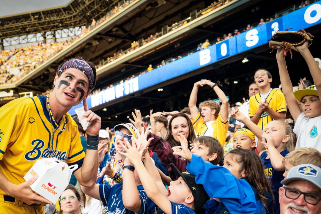 (Left) Savannah Bananas pitcher Connor Harris interacts with fans during the Savannah Bananas versus Indianapolis Clowns game at Coors Field in Denver on Aug. 15, 2026. (Center) Pitcher Connor Harris signs an autograph for a fan in Denver on Aug. 15, 2026. (Right) Savannah Bananas player Ty “pookie” Jackson interacts with fans during the game at Coors Field in Denver on Aug. 15, 2026. (Madalina Kilroy/The Epoch Times)