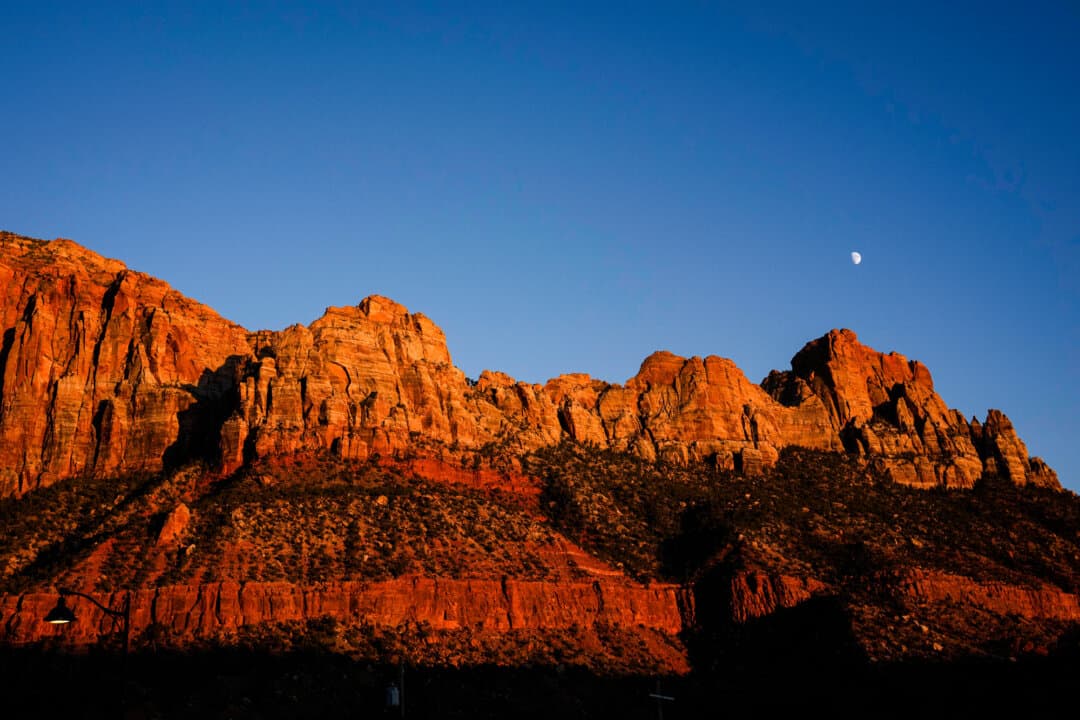 The moon rises above a sandstone escarpment at Zion National Park near Springdale, Utah, on Oct. 1, 2025. At least 18 U.S. national parks have been designated Dark Sky Parks for their exceptionally dark skies and prime stargazing conditions. (John Locher/AP Photo)