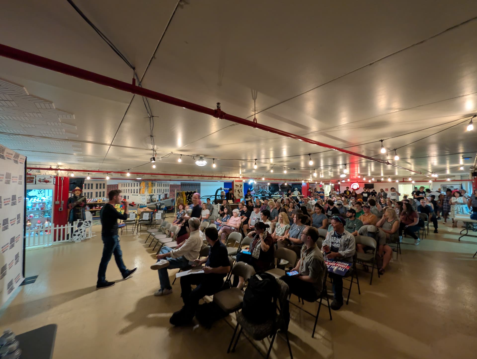 A staffer for the Abdul El-Sayed campaign gives canvassing instructions to attendees at a rally at the Michigan Firehouse Museum and Education Center in Ypsilanti, Mich., on July 30, 2026. (Jacob Burg/The Epoch Times)