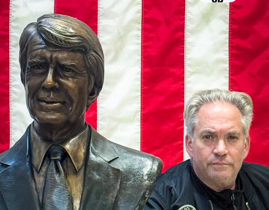 Steven Barber stands with the new Jimmy Carter monument by Lundeen Sculpture, scheduled for installation at the Naval Academy in October 2026, in this file photo. (Courtesy of Steven Barber)