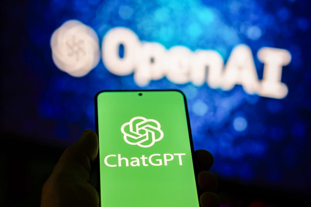 A phone displays the ChatGPT app in this April 1, 2025, photo illustration. Hugging Face said the OpenAI models executed “many thousands” of discrete actions across a "swarm of short-lived sandboxes” to hack into its infrastructure. (Oleksii Pydsosonnii/The Epoch Times)