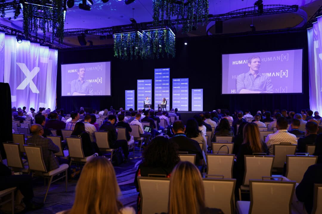 Thomas Wolf, Hugging Face cofounder and chief science officer, and Rachel Metz speak onstage during the HumanX AI Conference 2025 in Las Vegas on March 11, 2025. (Big Event Media/Getty Images for HumanX Conference)