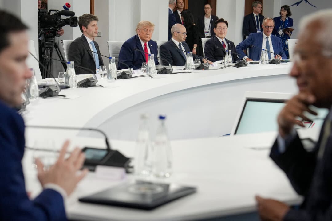 U.S. President Donald Trump (Top 2nd L) sits with OpenAI CEO Sam Altman, Google DeepMind CEO Demis Hassabis, South Korean President Lee Jae Myung, and German Chancellor Friedrich Merz during a working lunch at the G7 summit in Evian, France, on June 17, 2026. (Julia Demaree Nikhinson/POOL/AFP via Getty Images)