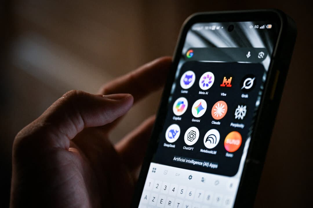 A smartphone displays the icons of some of the main artificial intelligence-based apps, including Meta AI, Grok, Gemini, Perplexity, DeepSeek, and ChatGPT, in Saint-Mandé, France, on July 15, 2026. (Martin Lelievre/AFP via Getty Images)