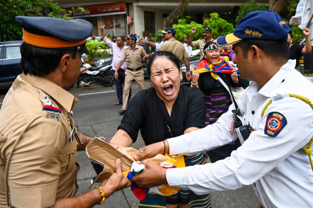 Police detain Tibetan refugees near the Chinese Consulate in Mumbai on Aug. 3, 2026, during a protest against China's "Ethnic Unity and Progress" law. (Punit Paranjpe/AFP via Getty Images)