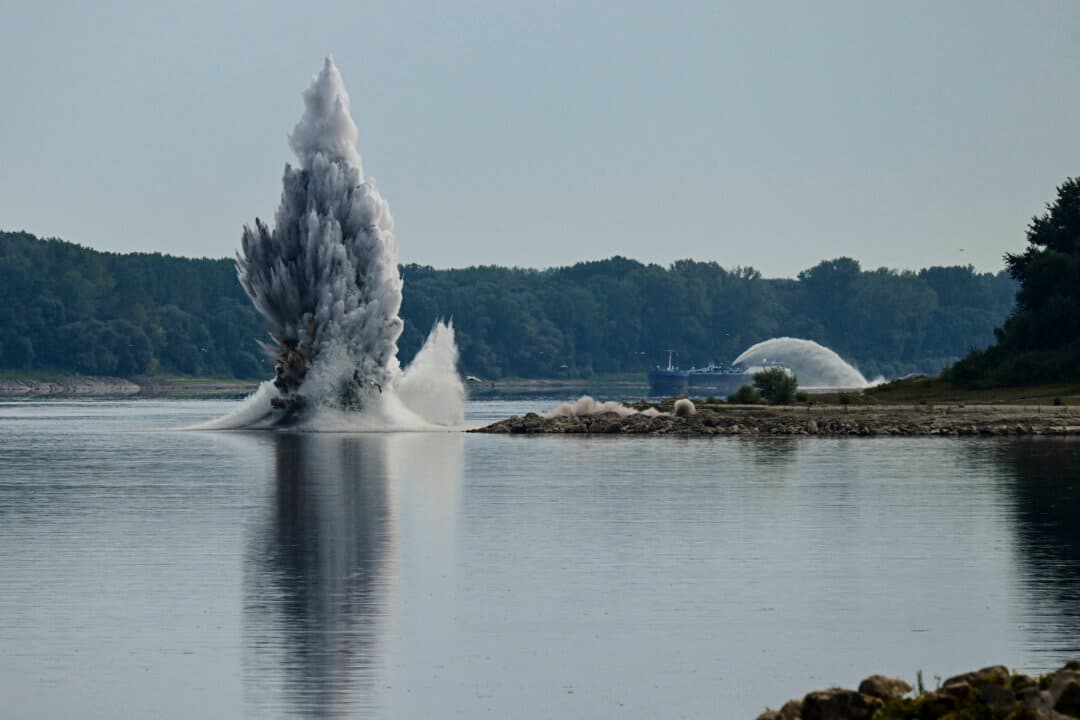 A controlled underwater explosion in the Danube River near Izvoarele, Romania, on Aug. 3, 2026. The blast was intended to deepen the channel and divert a higher volume of water toward the cooling systems of the Cernavoda Nuclear Power Plant. Local authorities and plant engineers authorized the blasting operations to counteract critically low water levels caused by a prolonged summer heatwave, ensuring the continuous and safe operation of the facility's reactors. (Daniel Mihailescu/AFP via Getty Images)