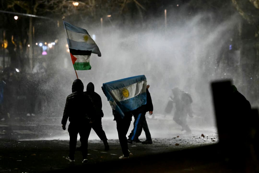 Police use a water cannon to disperse demonstrators during a protest near the National Congress in Buenos Aires on Aug. 6, 2026, as senators debate a bill on the inviolability of private property. (Luis Robayo/AFP via Getty Images)