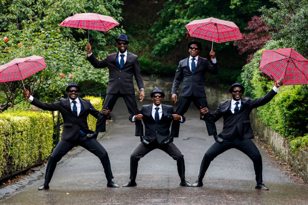 The Black Blues Brothers pose during a photocall for `The Black Blues Brothers: Let's Twist Again!` in front of the Scottish National Gallery in Edinburgh, Scotland, on Aug. 4, 2026. The Black Blues Brothers are five Kenyan acrobats performing a range of stunts set to a rock'n'roll soundtrack. (Jeff J. Mitchell/Getty Images)