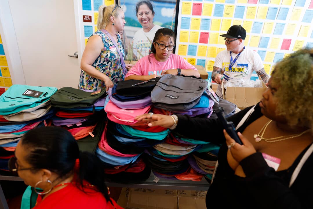 Volunteers fill backpacks with school supplies at Big Sunday in Los Angeles on Aug. 5, 2026. The L.A.-based nonprofit Big Sunday hosted its 17th annual Back to School Week, bringing together hundreds of volunteers to fill 5,500 backpacks for elementary school students in need across Southern California. (Justin Sullivan/Getty Images)