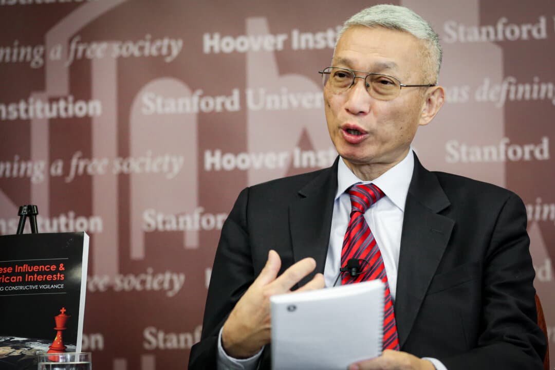 Minxin Pei, professor of government at Claremont McKenna College, speaks at an event at the Hoover Institution in Washington on Nov. 29, 2018. Pei said the Chinese Communist Party found a cheaper way to monitor far more people through a public program called the people’s line of defense—built around national security education in schools and workplaces and a hotline for reporting suspected spies. (Jennifer Zeng/The Epoch Times)