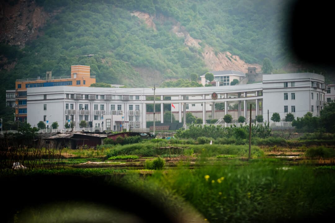 A photo taken through a car window shows the Zhuzhou Baimalong Labor Camp in Hunan Province, China, on April 29, 2013. Before 2013, Chinese police could send people to reeducation through labor for up to four years without a formal court trial. (Ed Jones/AFP via Getty Images)