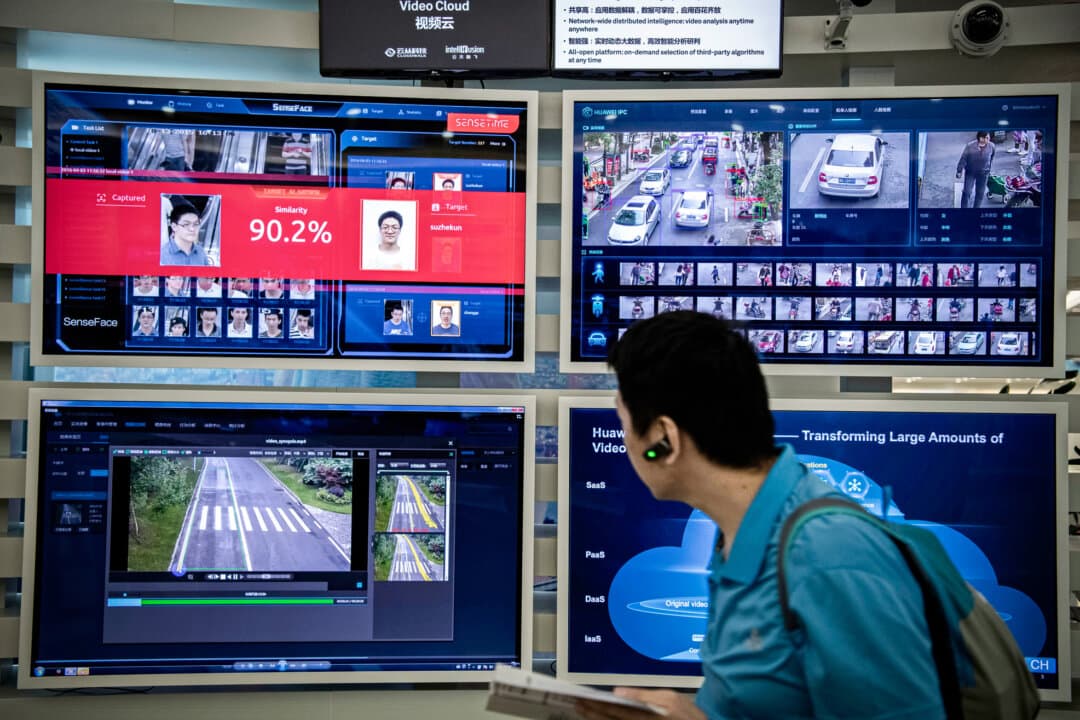 A facial recognition and artificial intelligence display is shown on monitors at Huawei's Bantian campus in Shenzhen, China, on April 26, 2019. June Teufel Dreyer said advances in such technologies pushed for a revival and intensification of Mao-era methods of social control. (Kevin Frayer/Getty Images)