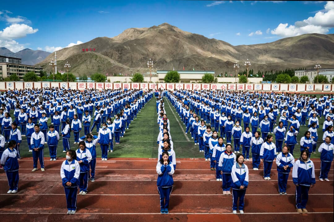 Tibetan students from the Second Senior High School exercise line up during a government-organized visit in Shannan, Tibet, China, on June 18, 2023. Political scientist June Teufel Dreyer said that many of the surveillance methods now used across China were tried first in Xinjiang and Tibet. (Kevin Frayer/Getty Images)