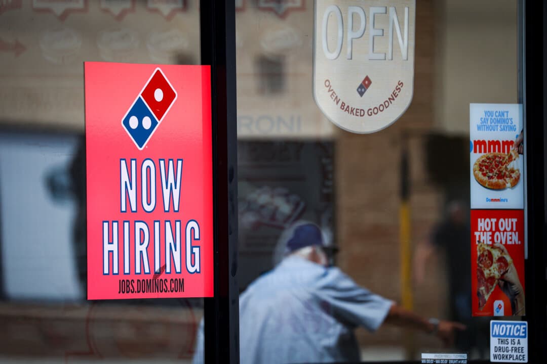 A now-hiring sign is posted in the window of a Domino's Pizza restaurant in Los Angeles on June 5, 2026. An outplacement firm used Bureau of Labor Statistics data to forecast teenagers gaining 790,000 jobs through May, June, and July, which would be down from last year’s 801,000. (Justin Sullivan/Getty Images)