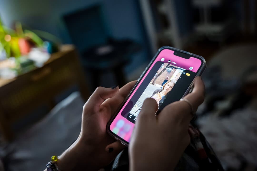 In this photo illustration, a teenager uses a mobile phone to access social media in New York City on Jan. 31, 2024. Social Media Safety CEO Marc Berkman said research shows that millions of children are harmed by cyberbullying, sexting, violent content, and other risks highlighted in the Heat Initiative reports. (Spencer Platt/Getty Images)