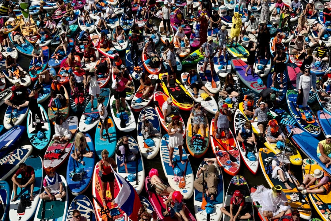 Participants attend the Yauzafest SUP stand-up paddle boarding festival on the Yauza river in Moscow on Aug. 9, 2026. (Igor Ivanko/AFP via Getty Images)