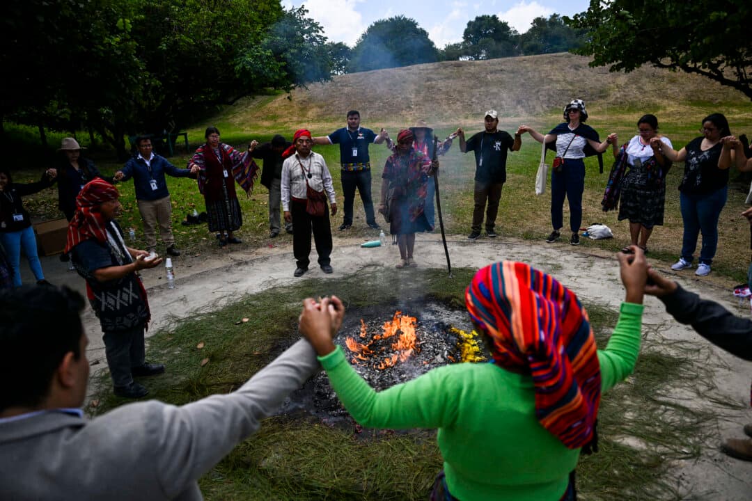 Indigenous people take part in a Mayan ceremony commemorating the International Day of the World's Indigenous Peoples, at the archaeological site of Kaminal Juyu, in Guatemala City, Guatemala, on Aug. 10, 2026. (Johan Ordonez/AFP via Getty Images)