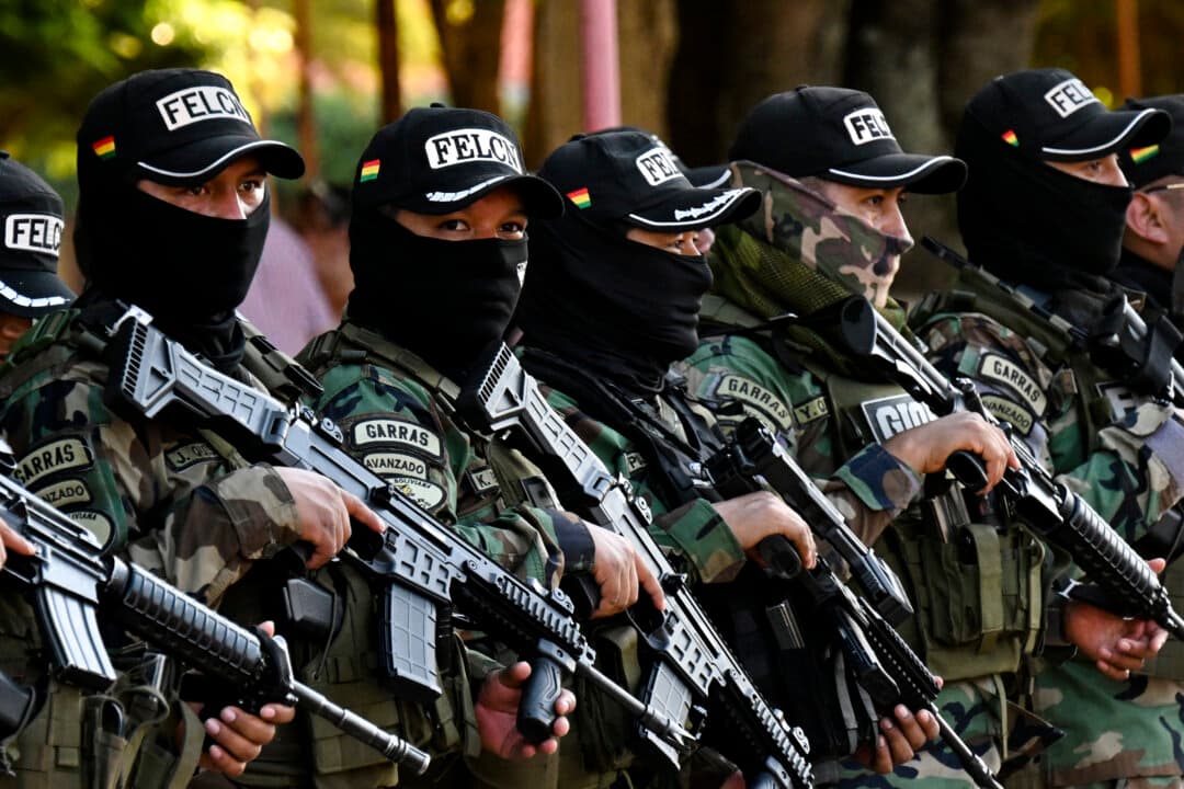 Bolivian Police officers of the Special Force for the Fight Against Drug Trafficking stand guard during a Bolivia-Brazil border security plan in Guayaramerin, Bolivia, on Aug. 13, 2026. (Aizar Raldes/AFP via Getty Images)
