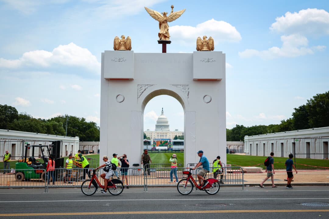 A scale replica of President Donald Trump's proposed 250-foot-tall triumphal arch stands in the middle of the National Mall along 7th Street Northwest in Washington on June 22, 2026. The display was part of Trump's Freedom 250 Great American State Fair, which filled the mall with 150 exhibits from all 56 states and territories. (Chip Somodevilla/Getty Images)