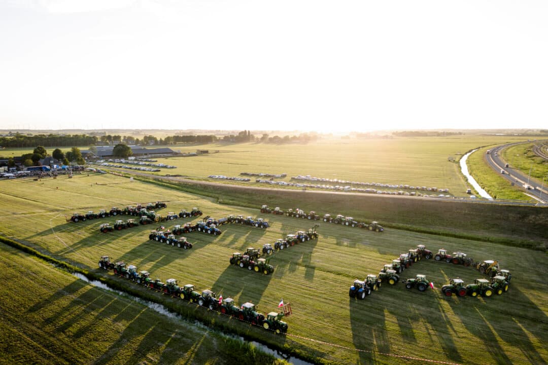 This aerial photograph shows farmers as they arrange their tractors in the shape of the word HELP on a field during a demonstration to protest against the Dutch cabinet's newly announced nitrogen plans in Schermerhorn, western Netherlands on Aug. 13, 2026. (Wouter de Wilde/ANP/AFP via Getty Images)