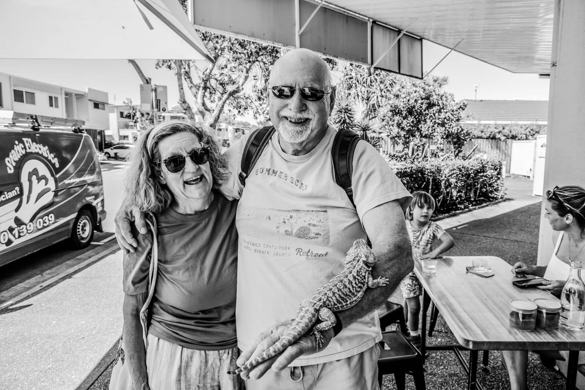 Photographer David Holman and his wife, Pam, out and about with a bearded dragon. (Courtesy of David Holman)