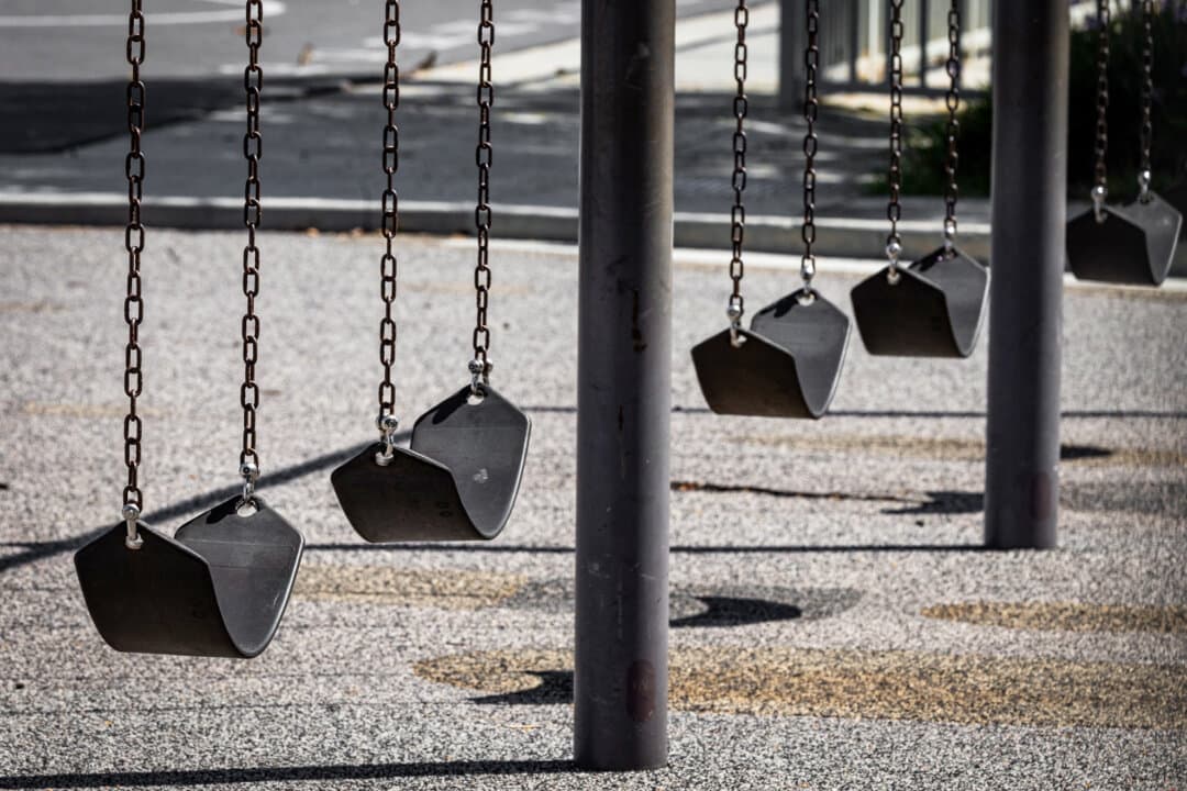 Swings sit idle in a school playground in Ladera Ranch, Calif., on July 24, 2026. (John Fredricks/The Epoch Times)
