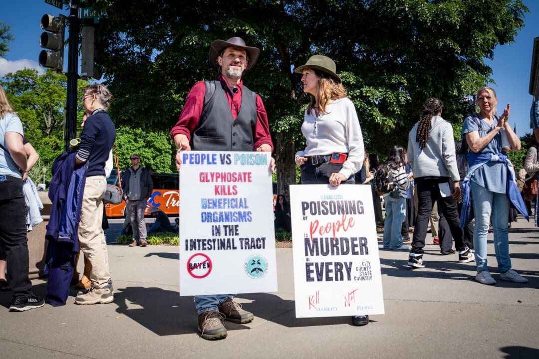 Protesters take part in a "People vs. Poison" rally against pesticides while the Supreme Court hears a pesticide liability case in Washington on April 27, 2026. (Madalina Kilroy/The Epoch Times)