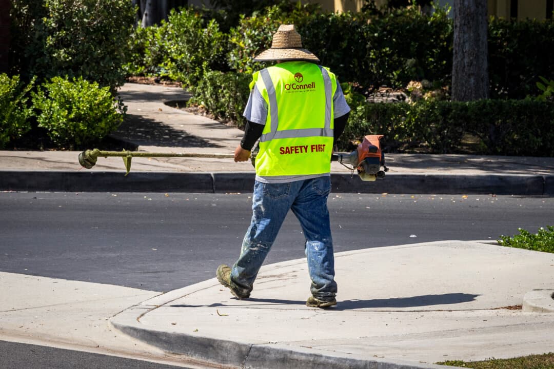 Landscapers with O'Connell operate in Ladera Ranch, Calif., on July 24, 2026. O’Connell Kara Bell told her they stopped using the controversial weed killer glyphosate in 2016. However, records show they were still applying it in 2019. (John Fredricks/The Epoch Times)