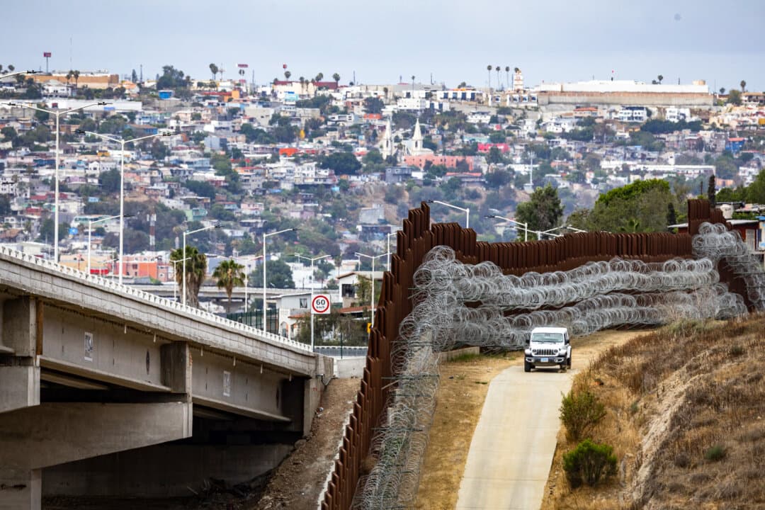 (Top, Bottom Left) Justin M. De La Torre, chief patrol agent for the U.S. Border Patrol's San Diego sector, monitors the southern border wall outside of San Diego, on May 27, 2026. De La Torre said cartels are using dating apps to engage unsuspecting travelers in drug or human smuggling. (Bottom Right) U.S. Border Patrol agents monitor the southern border outside of San Diego, on May 27, 2026. (John Fredricks/The Epoch Times)