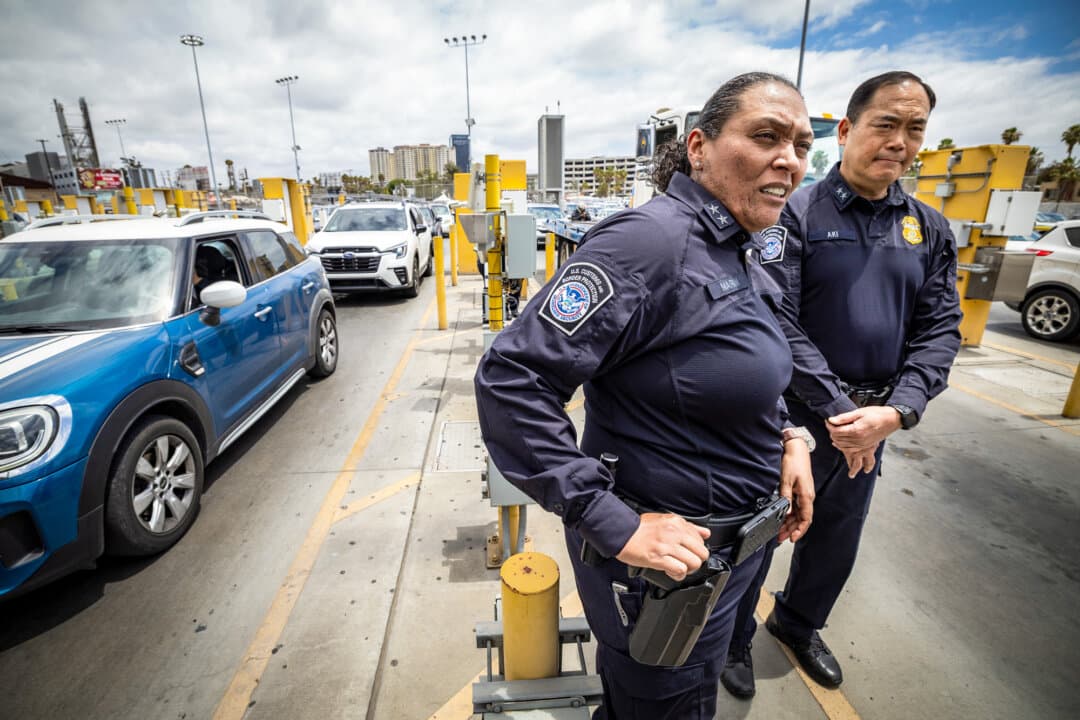 Sidney Aki, director of field operations at Customs and Border Protection's San Diego field office (Right), and Mariza Marin, Customs and Border Protection's San Ysidro Port director, view border entries at the San Ysidro Port of Entry outside of San Diego, on May 26, 2026. (John Fredricks/The Epoch Times)