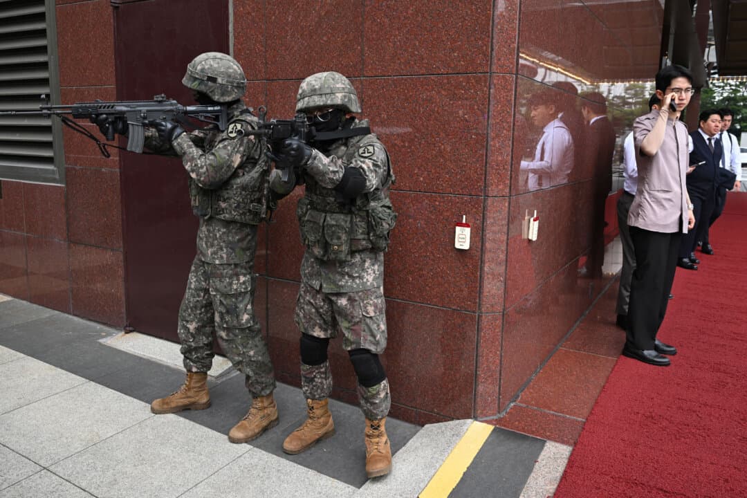 South Korean soldiers take part in an anti-terror drill at a hotel during the Ulchi Freedom Shield joint South Korea-U.S. military exercise, in Seoul, South Korea, on Aug. 19, 2026. The annual war games will end about a week earlier than planned after President Donald Trump ordered the drills scaled back. (Jung Yeon-je/AFP via Getty Images)