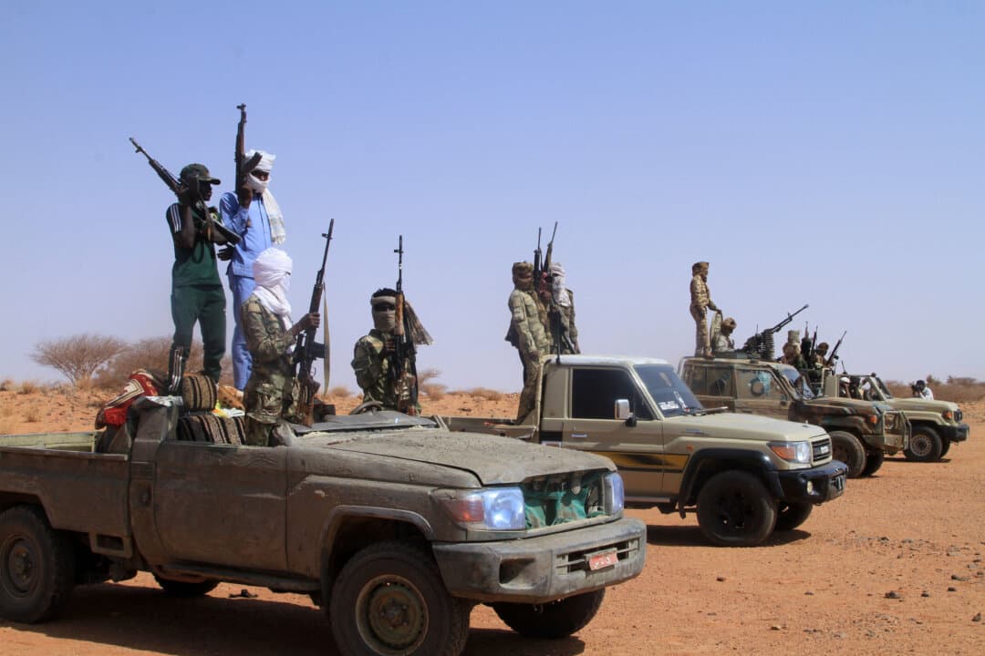Armed defectors from the paramilitary Rapid Support Forces (RSF) arrive in vehicles as they are believed to be surrendering to the Sudanese military, in Omdurman, Sudan, on Aug. 19, 2026. Sudan has been ravaged by war between the Sudanese military and the RSF since April 2023. (Ebrahim Hamid/AFP via Getty Images)