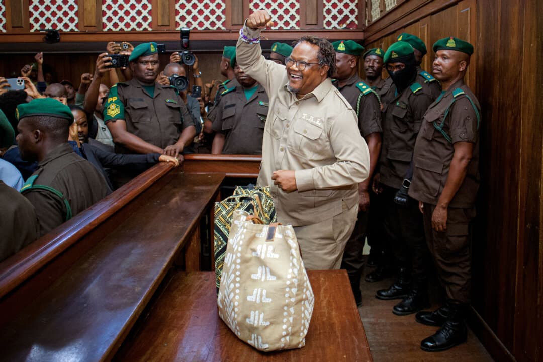 Tanzania's main opposition leader Tundu Lissu (C) gestures to supporters as he arrives at the High Court for a hearing in his treason trial in Dar es Salaam, Tanzania, on Aug. 21, 2026. A Tanzanian court ruled that Lissu's trial will go forward. (AFP via Getty Images)