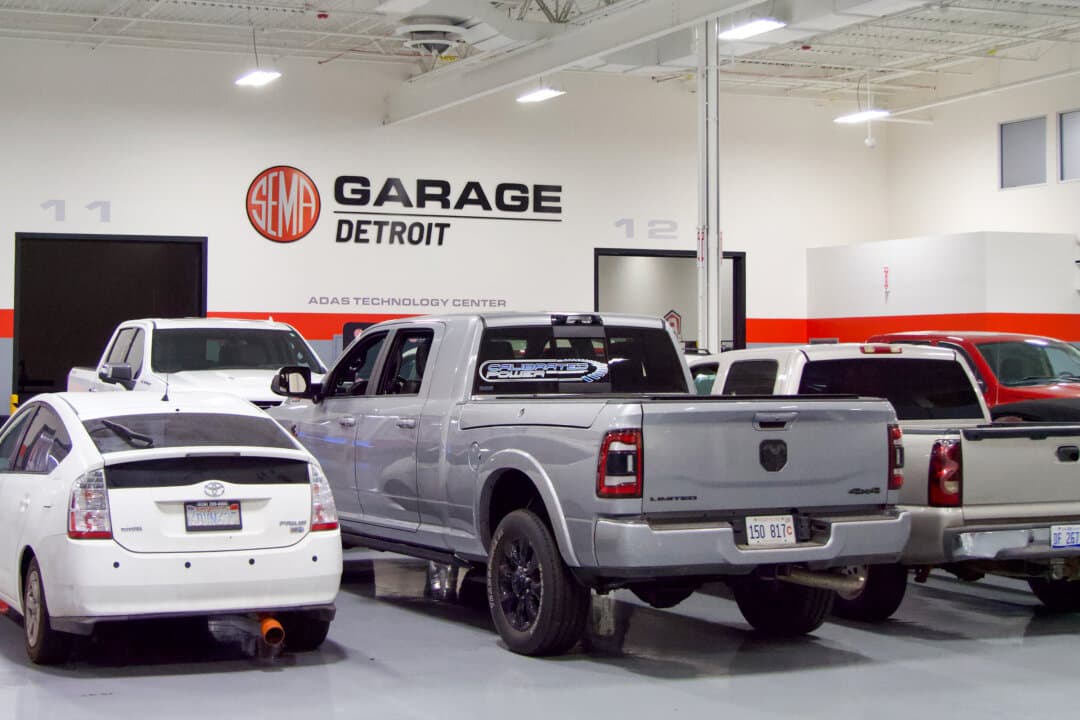 Vehicles await research and compliance testing at SEMA's Detroit Garage in Plymouth, Michigan, on July 28, 2026. SEMA’s Detroit Garage offers compliance testing for aftermarket products sold in 49 states, as seen in Plymouth, on July 28, 2026. (Travis Gillmore/The Epoch Times)