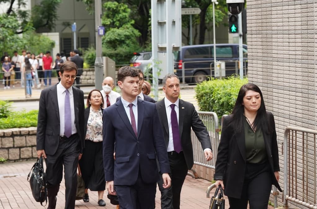Foreign diplomats walk into court ahead of the verdict in Hong Kong on Aug. 21, 2026. (Adrian Yu/The Epoch Times)