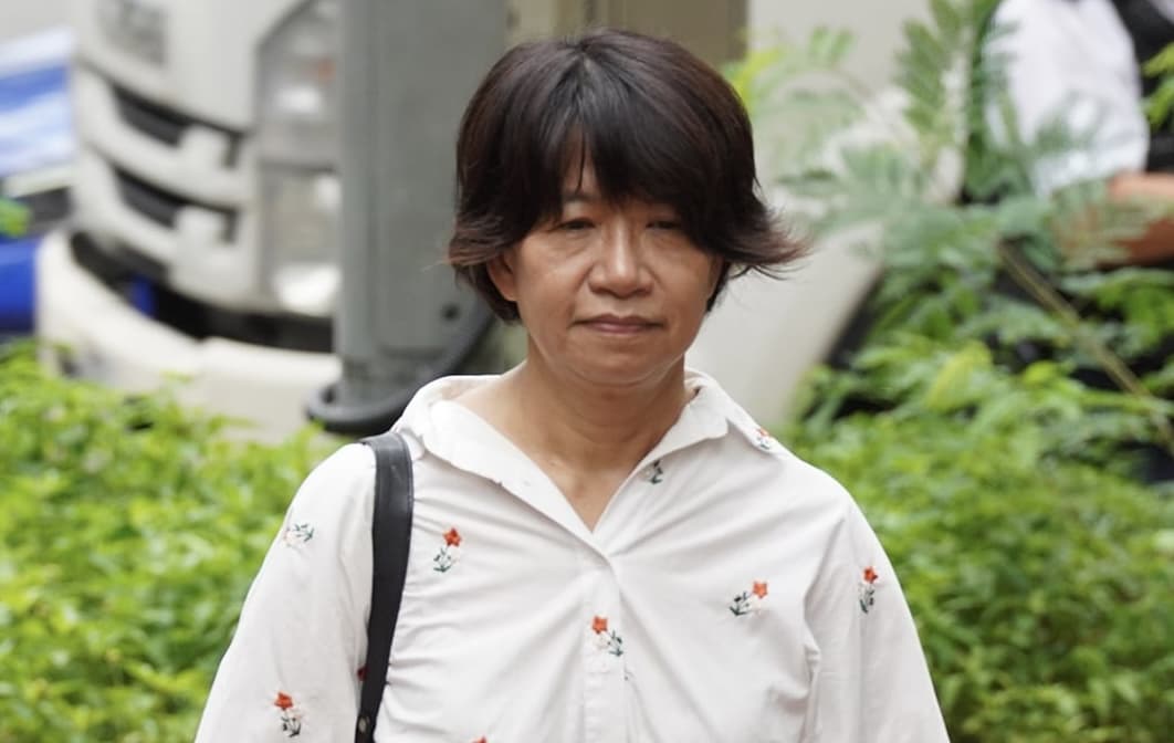 Elizabeth Tang Yin-ngor, wife of former union leader Lee Cheuk-yan, arrives at the West Kowloon Magistrates' Courts ahead of the verdict in the trial of two pro-democracy activists in Hong Kong on Aug. 21, 2026. (Adrian Yu/The Epoch Times)
