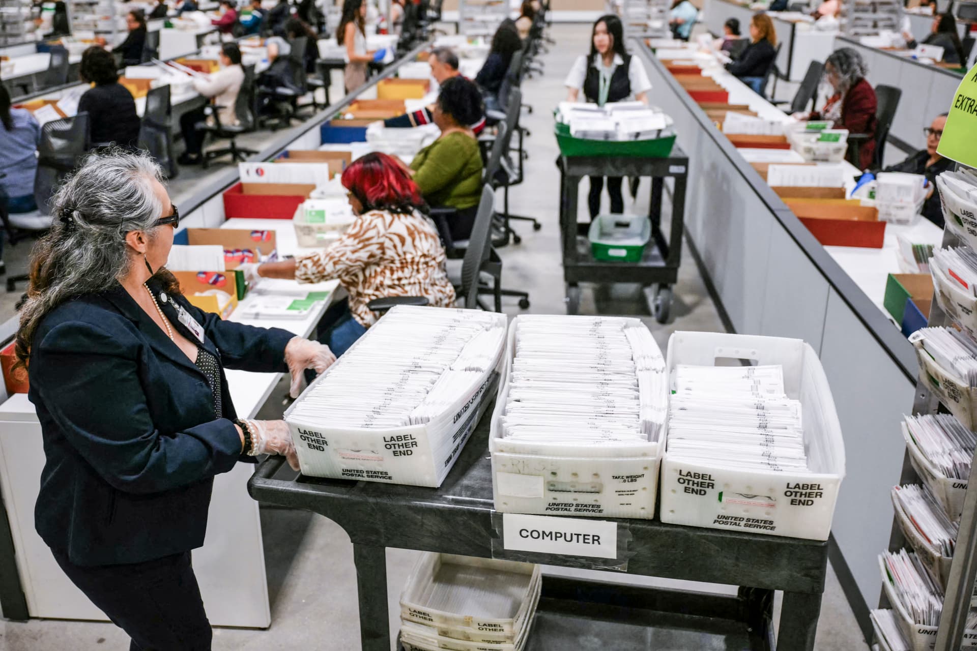 An election worker moves mail-in ballots to be organized for tabulation at the Los Angeles County Ballot Processing Center during California's state primary election in the City of Industry, Calif., on June 2, 2026. (Patrick T. Fallon/AFP via Getty Images)